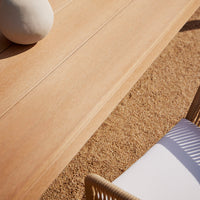 Light wood texture with natural grain, contrasting sandy tones, and a subtle white striped pattern on a chair.