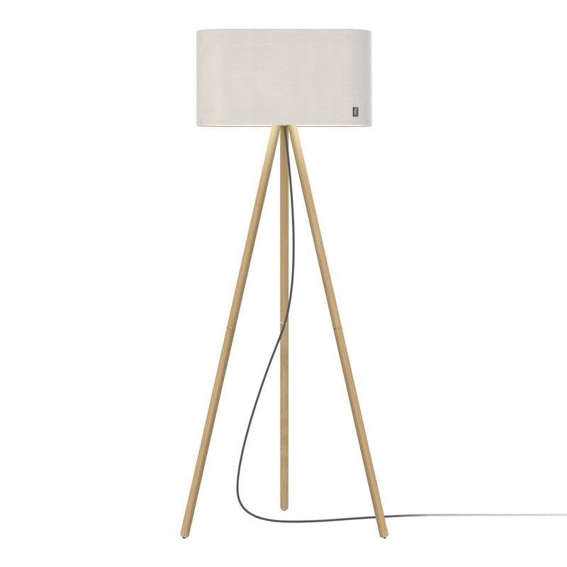 White cylindrical lampshade atop natural wood tripod legs, featuring a minimalist design and neutral color scheme.