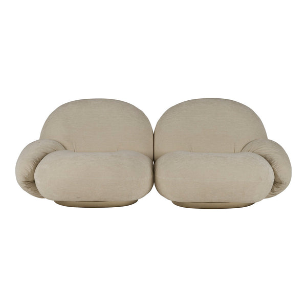 Beige, rounded couch with soft, cushiony forms; minimalistic design and a seamless fabric finish.