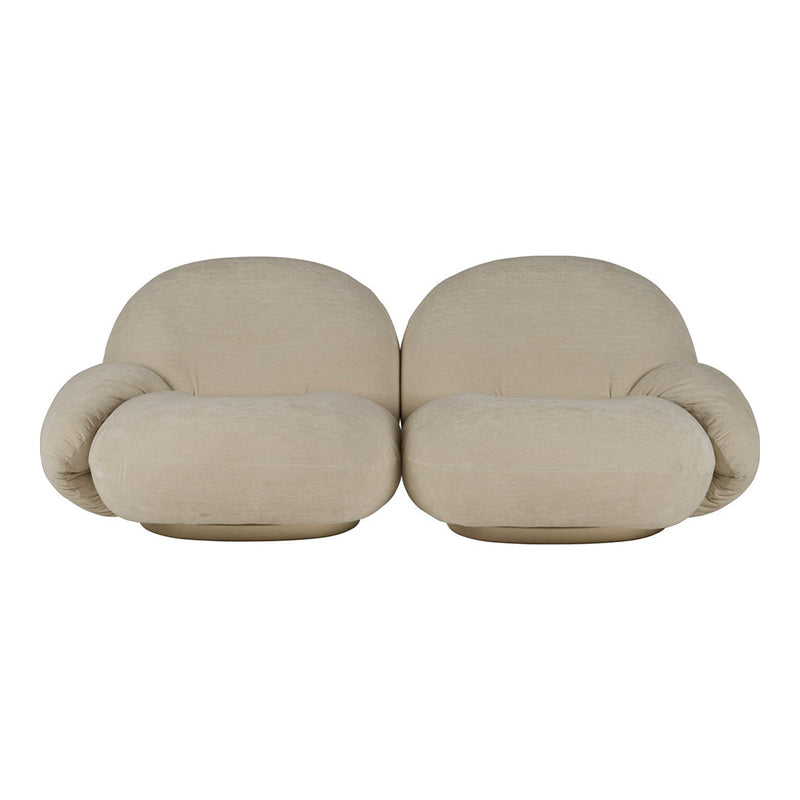 Beige, rounded couch with soft, cushiony forms; minimalistic design and a seamless fabric finish.