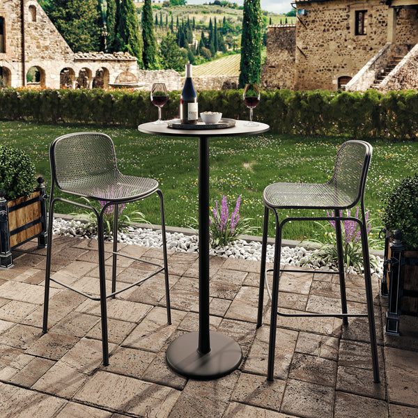 "Stylish outdoor bar set featuring a sleek black table and transparent mesh chairs against a scenic garden backdrop."