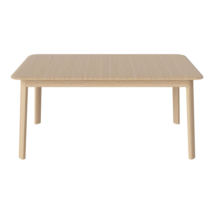 Light natural wood dining table with a smooth, minimalist design and soft, rounded edges.ideal for modern decor.