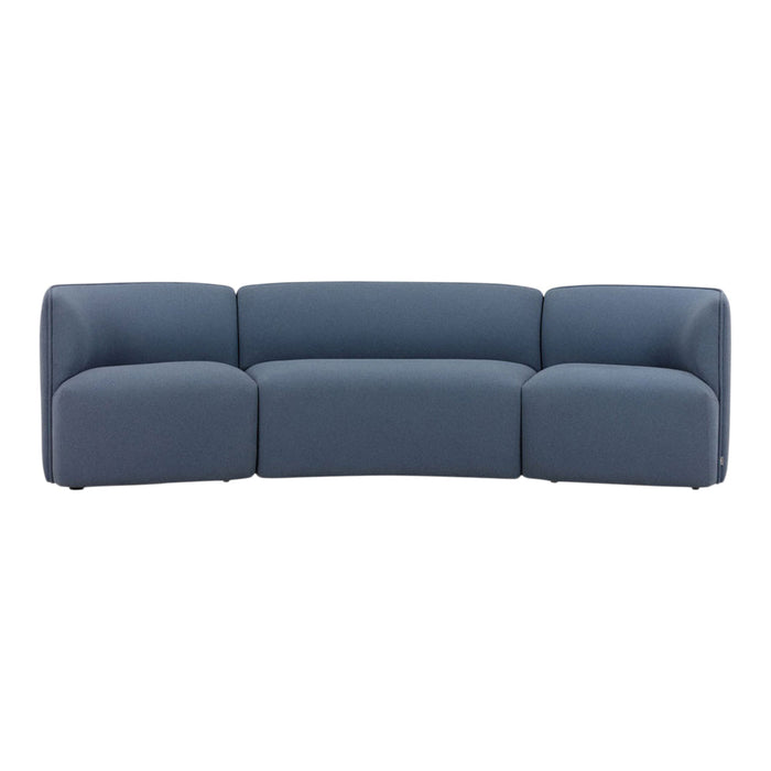 Curved sofa in a soft, muted blue fabric with a modern, minimalist design and smooth contours. Perfect for any space.
