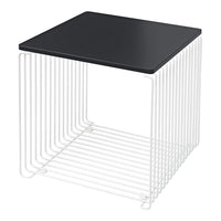 Modern black tabletop with white wireframe base, creating a sleek contrast in color and geometric pattern.