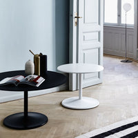 Modern black and white round coffee tables with sleek finishes, designed for a stylish living space.