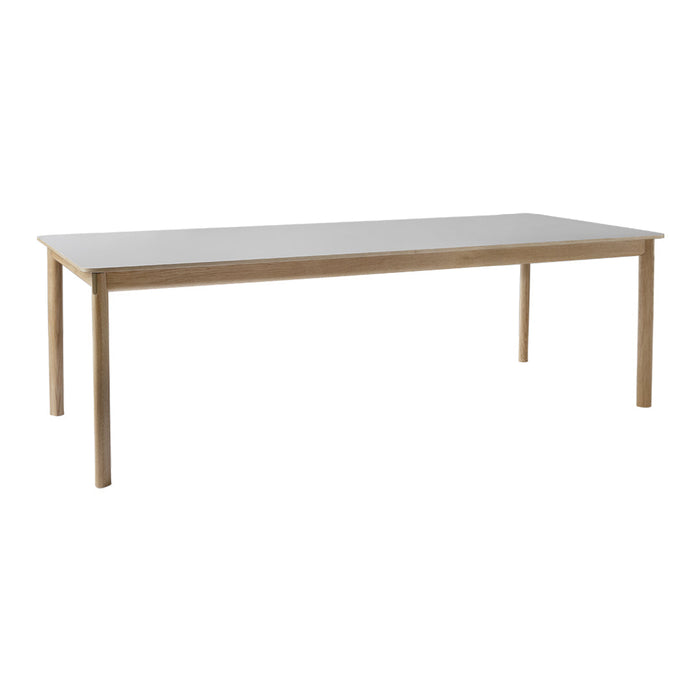Light wood dining table with a smooth, white surface and simple, clean design. Perfect for modern interiors.