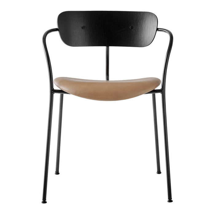 Black metal chair with a smooth tan seat, featuring a minimalist design and sleek curves.