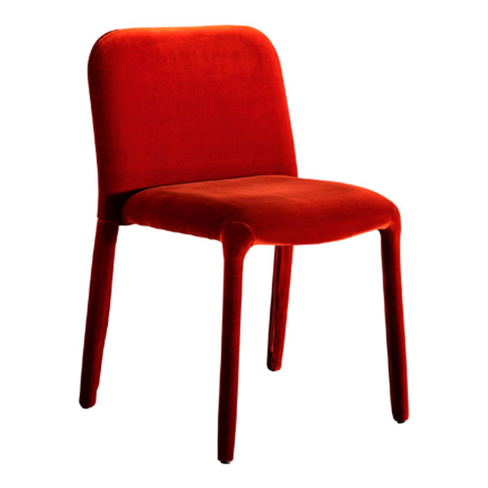 Velvety red chair with smooth, minimalist design, perfect for modern decor.