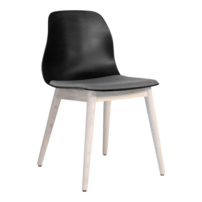 Modern chair in sleek black with a textured gray seat and light wood legs, perfect for contemporary decor.