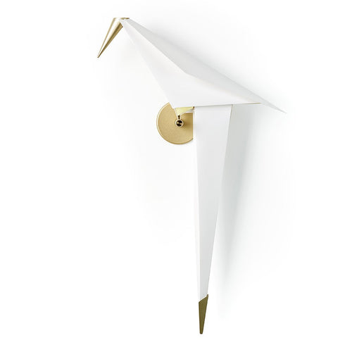 White wall lamp with sleek origami design and gold accents, creating a modern and elegant aesthetic.