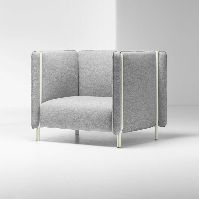 Modern gray armchair with textured fabric and sleek cream accents, featuring a minimalist design and clean lines.