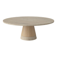 Round beige marble table with a natural wood base in a minimalist design. Smooth, neutral tones and simple patterns.