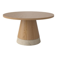 Round wooden dining table with a natural finish and a textured stone base, showcasing minimalistic design and neutral tones.