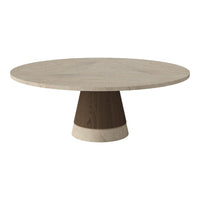 Round marble dining table with a textured light top and dark wood base, featuring a sleek modern design.