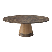 Round dining table with a dark marble top and a light wood base, featuring a modern, sleek design.