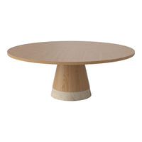 Elegant round dining table in light wood with a smooth surface and subtle beige stone base, showcasing clean lines and contemporary design.