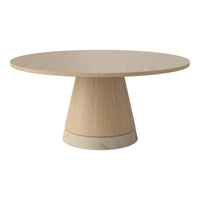 Light wood round dining table with a modern, smooth finish and a minimalist beige base. Perfect for contemporary decor.