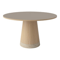 Round dining table with a light wood base, smooth gray top, and subtle textured cream accent at the base.
