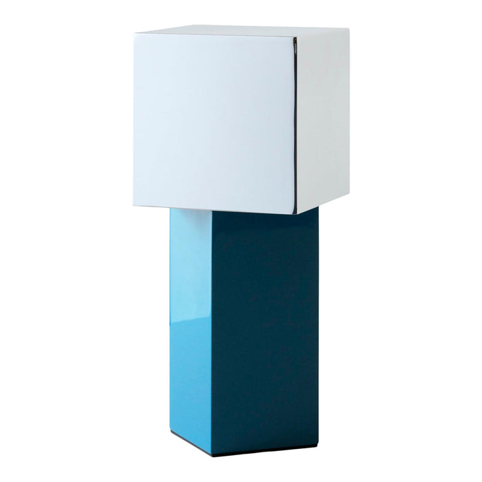 Modern lamp with a sleek white cube shade and a glossy teal base, featuring geometric shapes and vibrant color contrast.