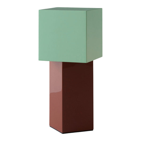 Geometric lamp featuring a mint green cube shade and a glossy brown rectangular base. Modern home decor accent.