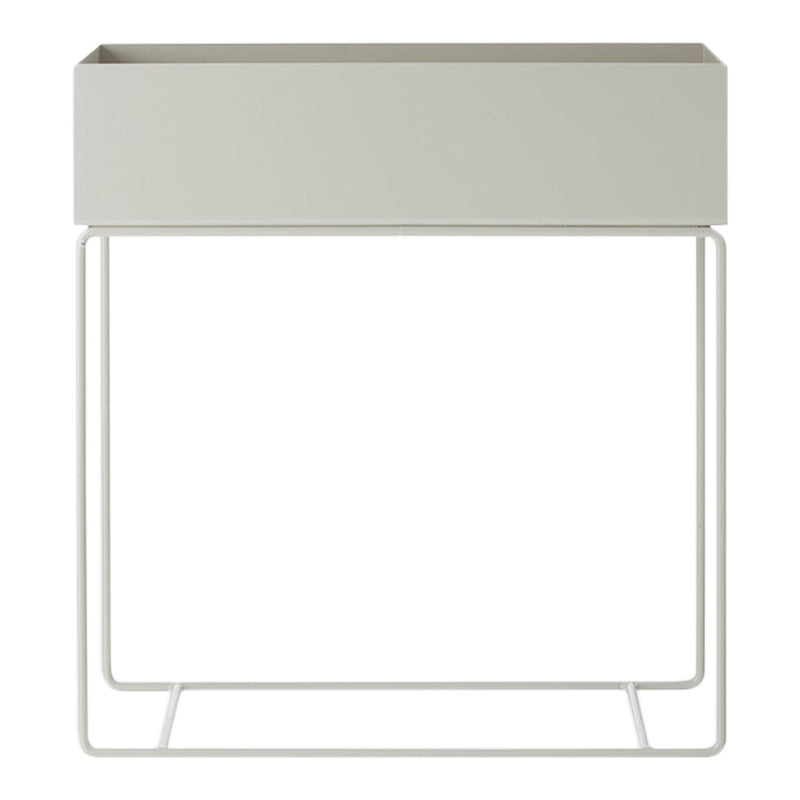 Gray planter with a sleek, minimalist design, featuring a matte surface and sturdy white metal frame.
