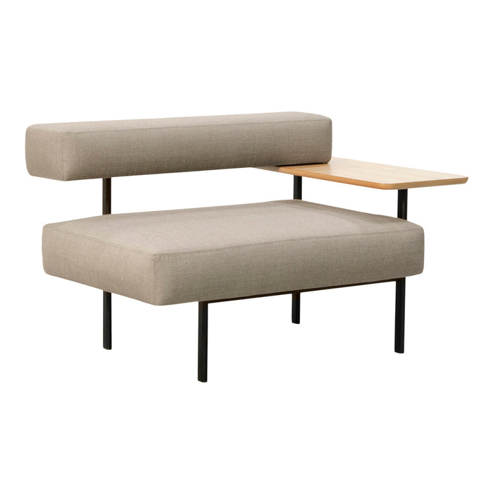 Modern beige couch with sleek black legs and a light wooden side table, featuring a minimalist design.