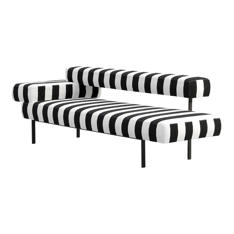 Black and white striped sofa with bold zigzag pattern, modern design, and sleek black metal legs.