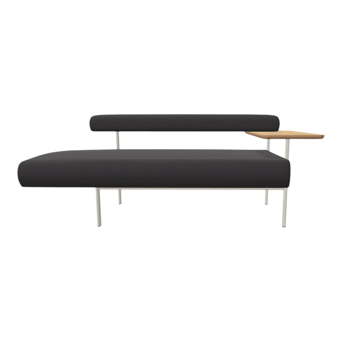 Black upholstered bench with a sleek, minimalist design and light wood accent table, supported by white metal legs.