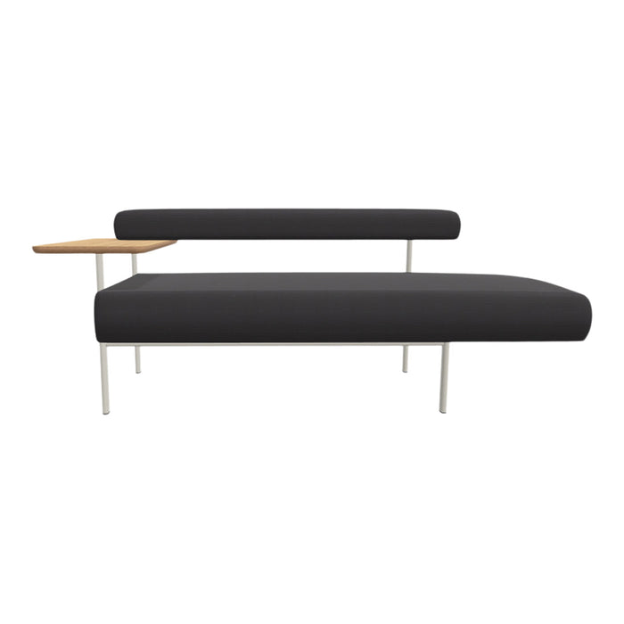 Modern black upholstered sofa with a sleek white metal frame and a light wood side table.