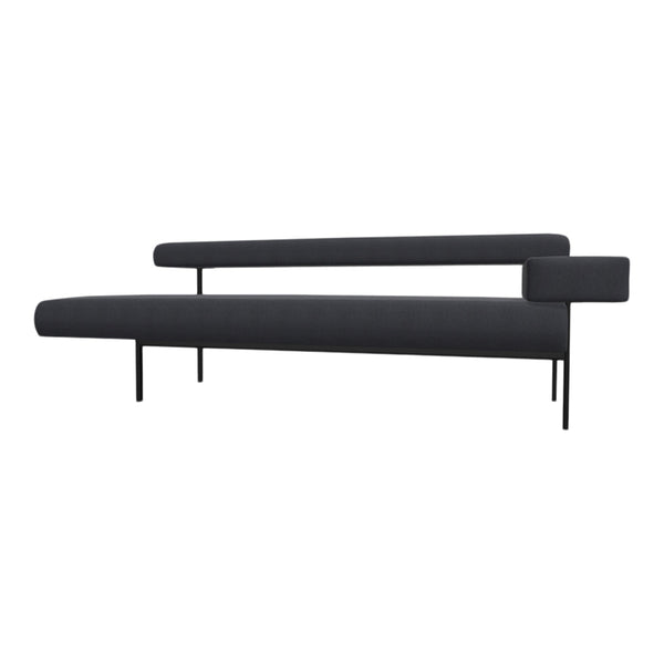 Sleek modern couch in deep charcoal gray fabric with minimalist black metal legs and accents. No visible patterns.