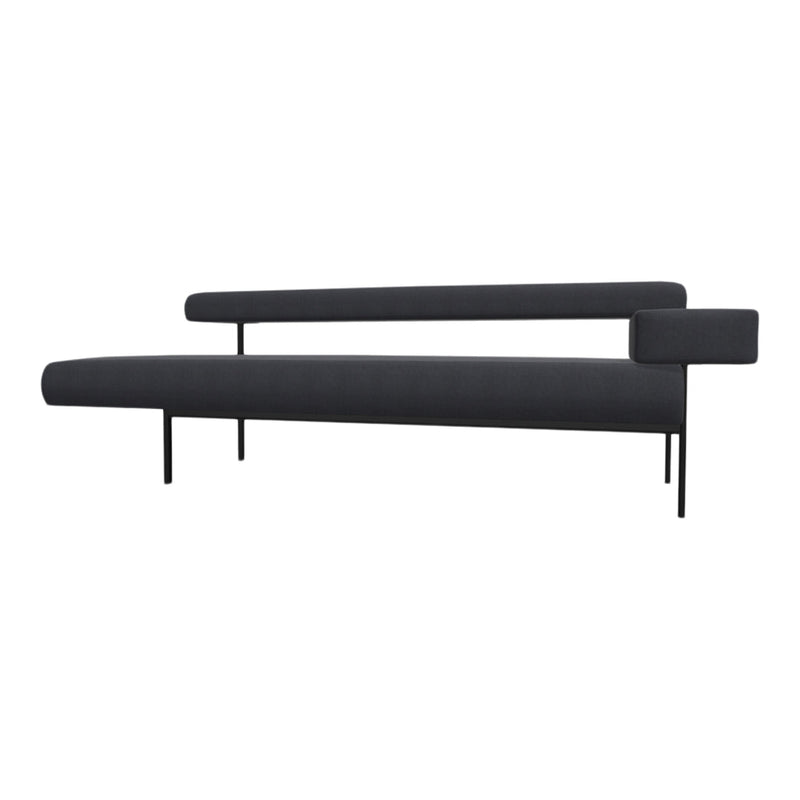 Sleek modern couch in deep charcoal gray fabric with minimalist black metal legs and accents. No visible patterns.