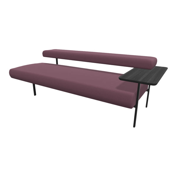 Modern sofa in rich burgundy with sleek black legs and a minimalist side table, featuring a textured fabric pattern.