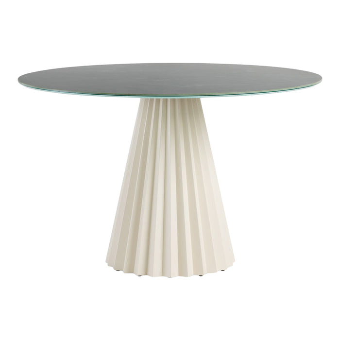 Round glass dining table with a pleated white base and sleek gray top, featuring a modern design and elegant colors.