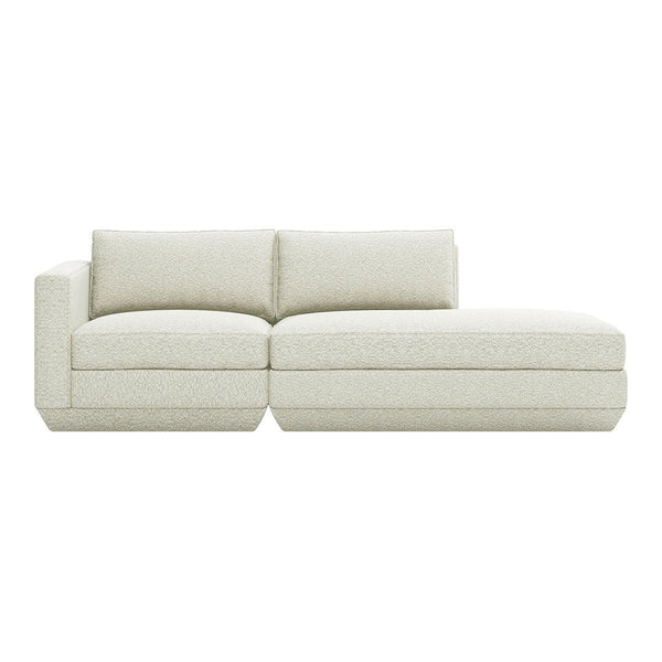 Cream-colored modern sectional sofa with a textured, plush fabric and minimalist design. Perfect for any living space.