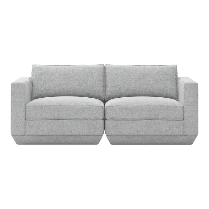 Light gray upholstered couch with a smooth texture and minimalist design, featuring two wide seat cushions.