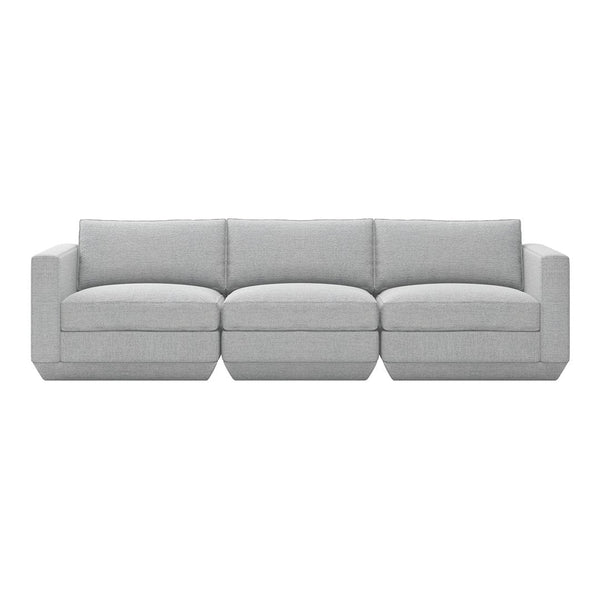 Gray sectional sofa with a modern, minimalist design and soft fabric upholstery, featuring clean lines and no patterns.