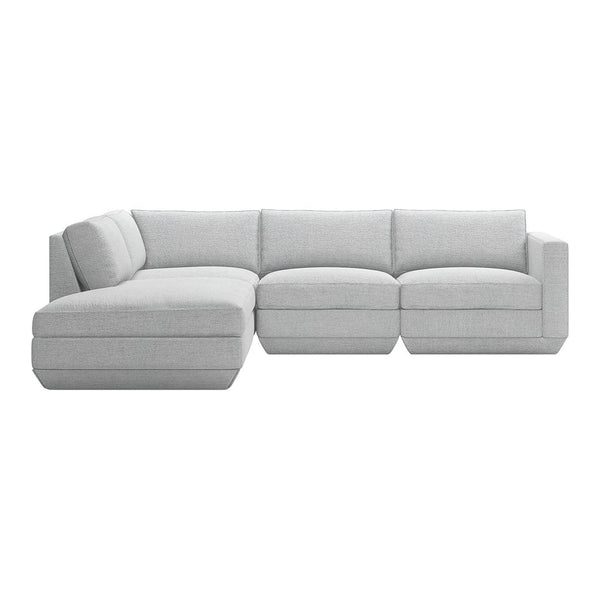 L-shaped sectional sofa in soft light gray fabric with seamless, minimalist design and plush cushions.