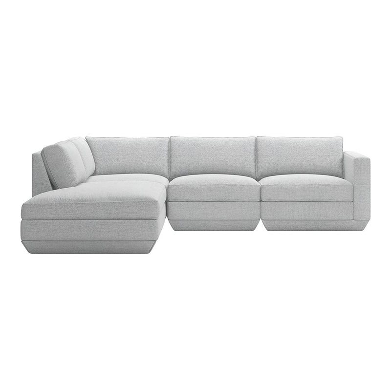 L-shaped sectional sofa in soft light gray fabric with seamless, minimalist design and plush cushions.
