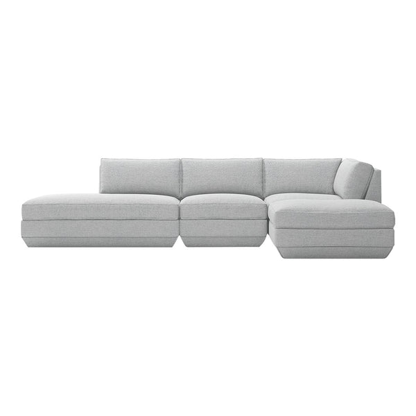 Light gray sectional sofa with a minimalist design and subtle texture for modern living spaces.