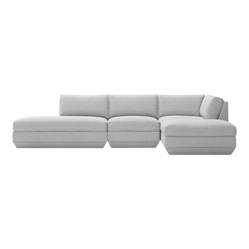 Light gray sectional sofa with a minimalist design and subtle texture for modern living spaces.