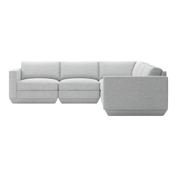 Gray sectional sofa with a smooth texture and minimalist design, featuring clean lines and soft, plush cushions.