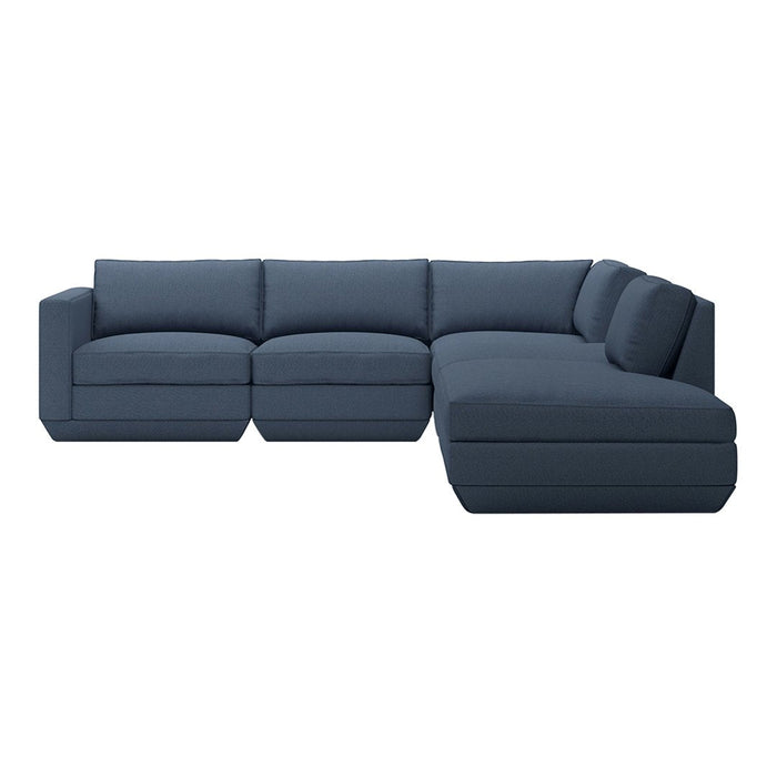 "Deep navy sectional sofa with smooth, solid upholstery for a modern and chic living room aesthetic."