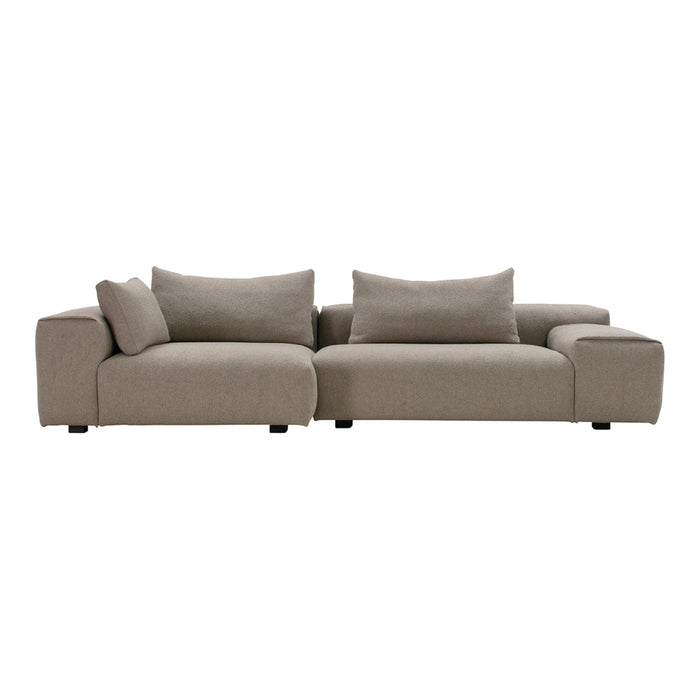 Stylish sectional sofa in a soft taupe hue with plush cushions, perfect for modern living room decor.