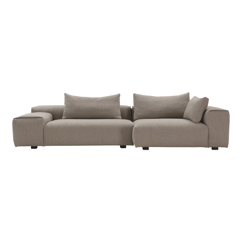 Modern beige sectional sofa with clean lines and plush cushions, perfect for contemporary living spaces.