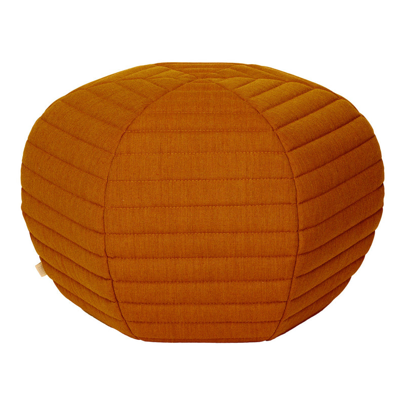 Rust-colored textured pouf with quilted stripes, perfect for adding a warm accent to any space.