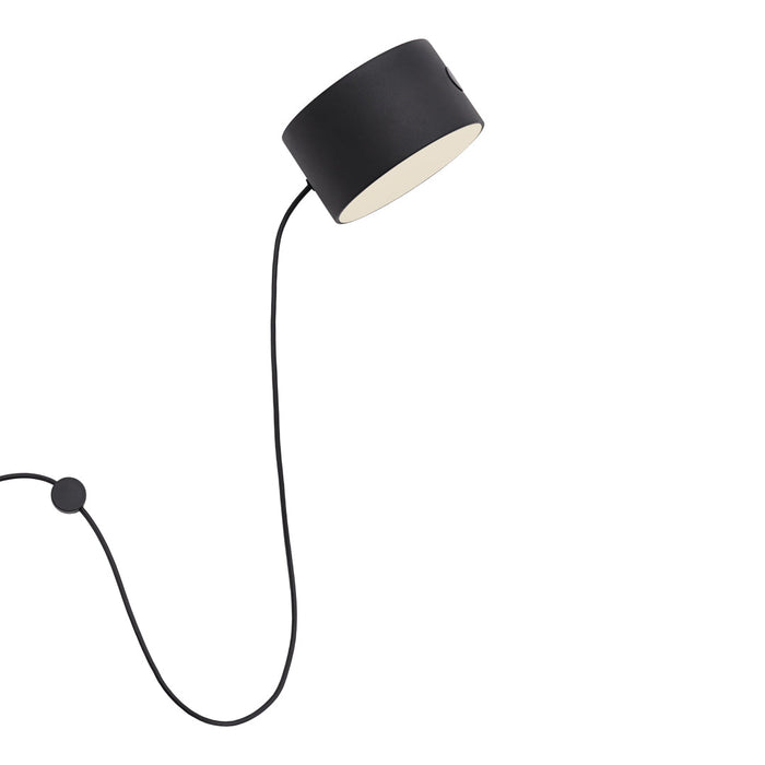 Minimalist black pendant lamp with a smooth white interior and a sleek black cord.