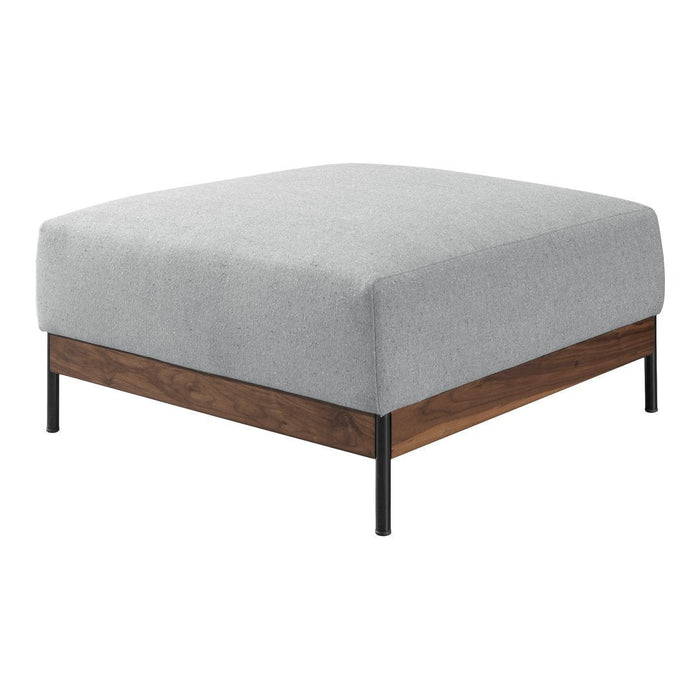 Gray upholstered square ottoman with a dark wooden base and black metal legs, offering a modern minimalist design.