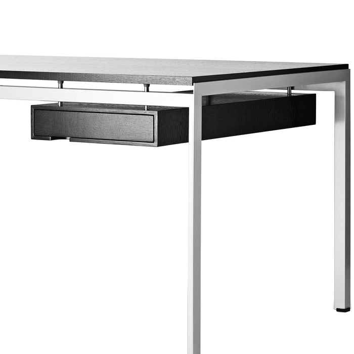 Modern silver desk with a sleek black drawer, featuring a minimalistic design and smooth geometric lines.