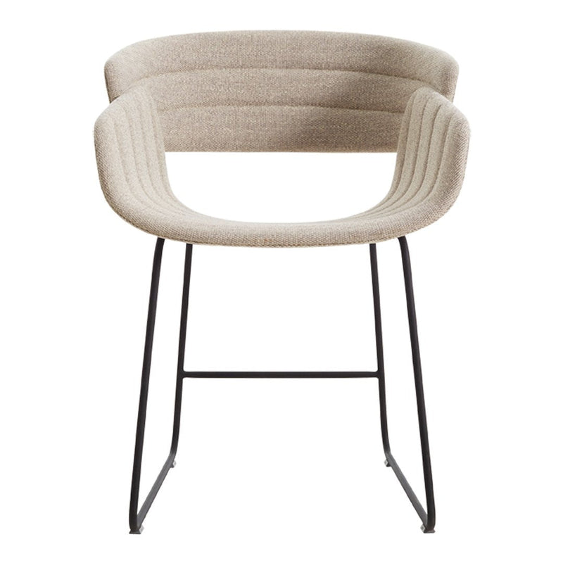 Beige upholstered chair with ribbed pattern and sleek black metal legs for a modern touch in any space.