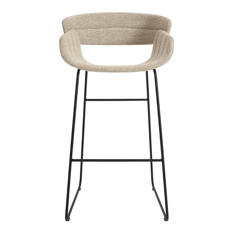 Beige upholstered bar stool with a ribbed fabric pattern and slim black metal legs. Perfect for modern decor.